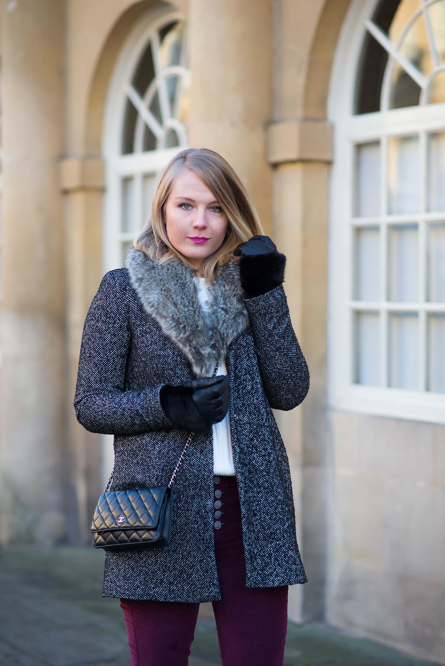 faux fur coat in grey on a fashion blogger